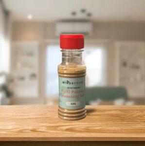 Mindo Foods Multi-Purpose Seasoning Salt sitting on a wooden counter in a house